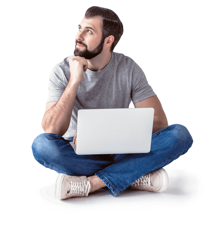 man sitting with a laptop on his lap